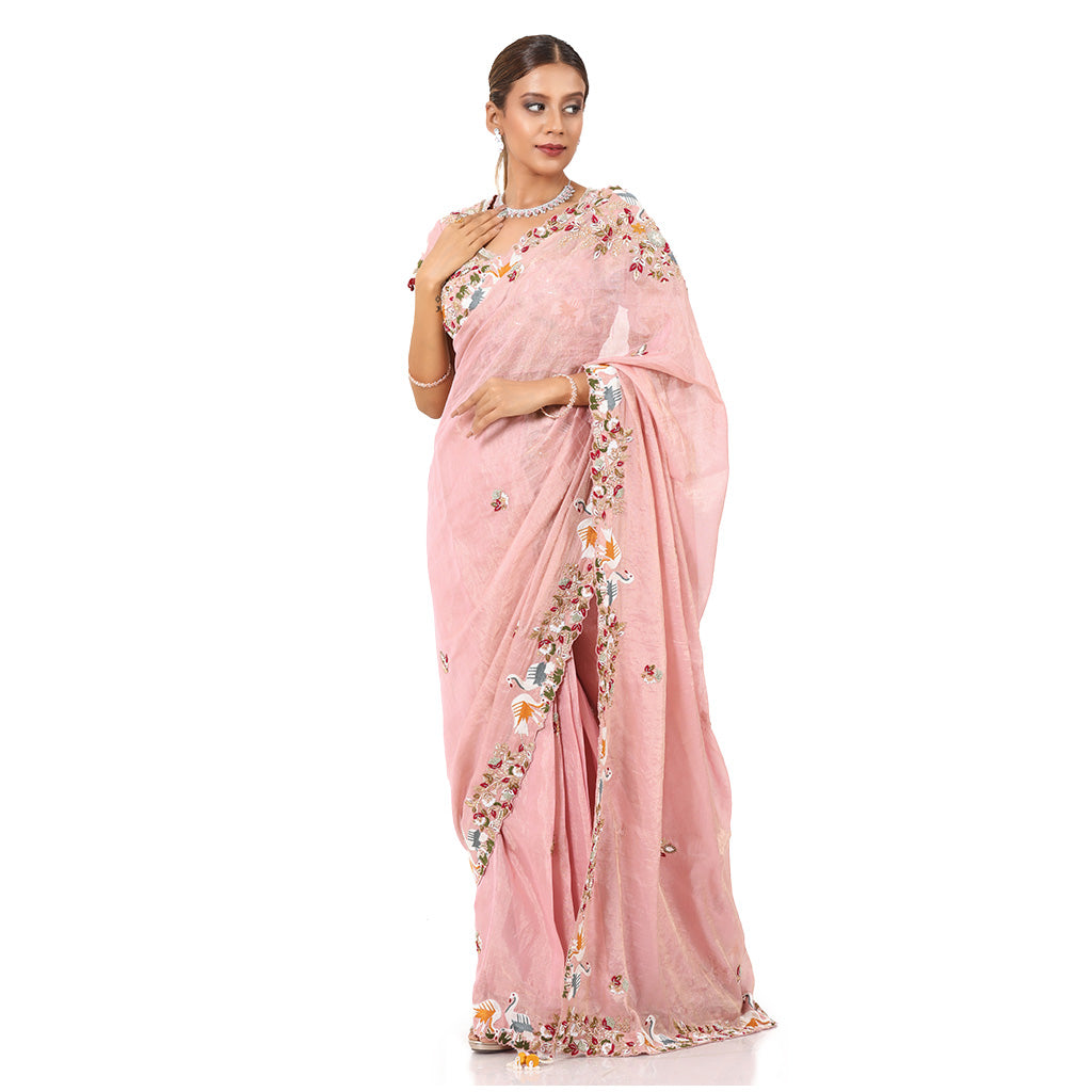 A woman wearing Pink Swan Saree.