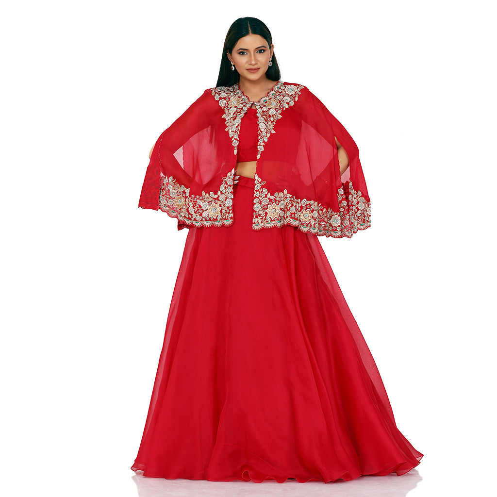 A woman wearing Crimson Red Organza Poncho with Skirt.