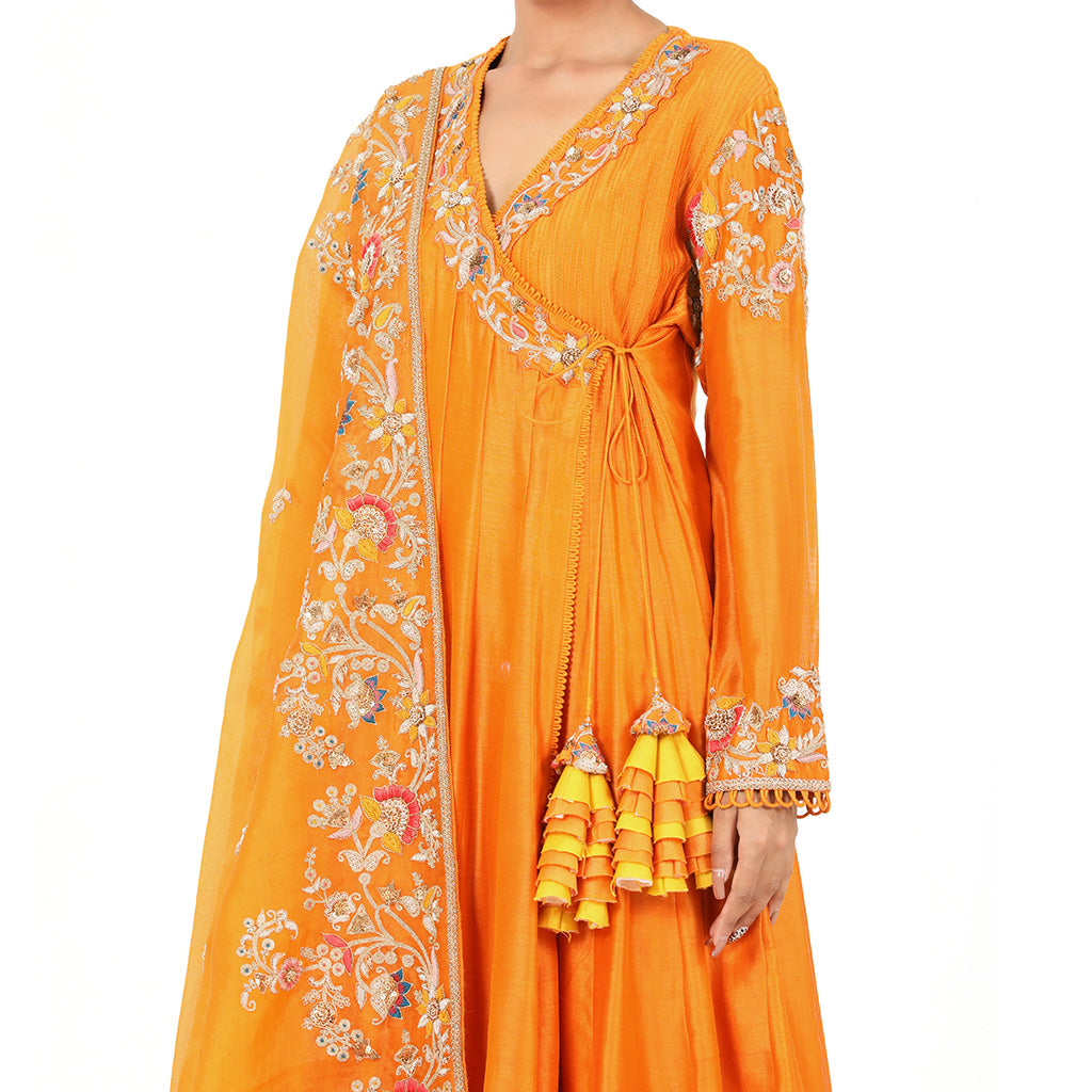 A woman wearing Designer Orange Dori Angrakha Dress.