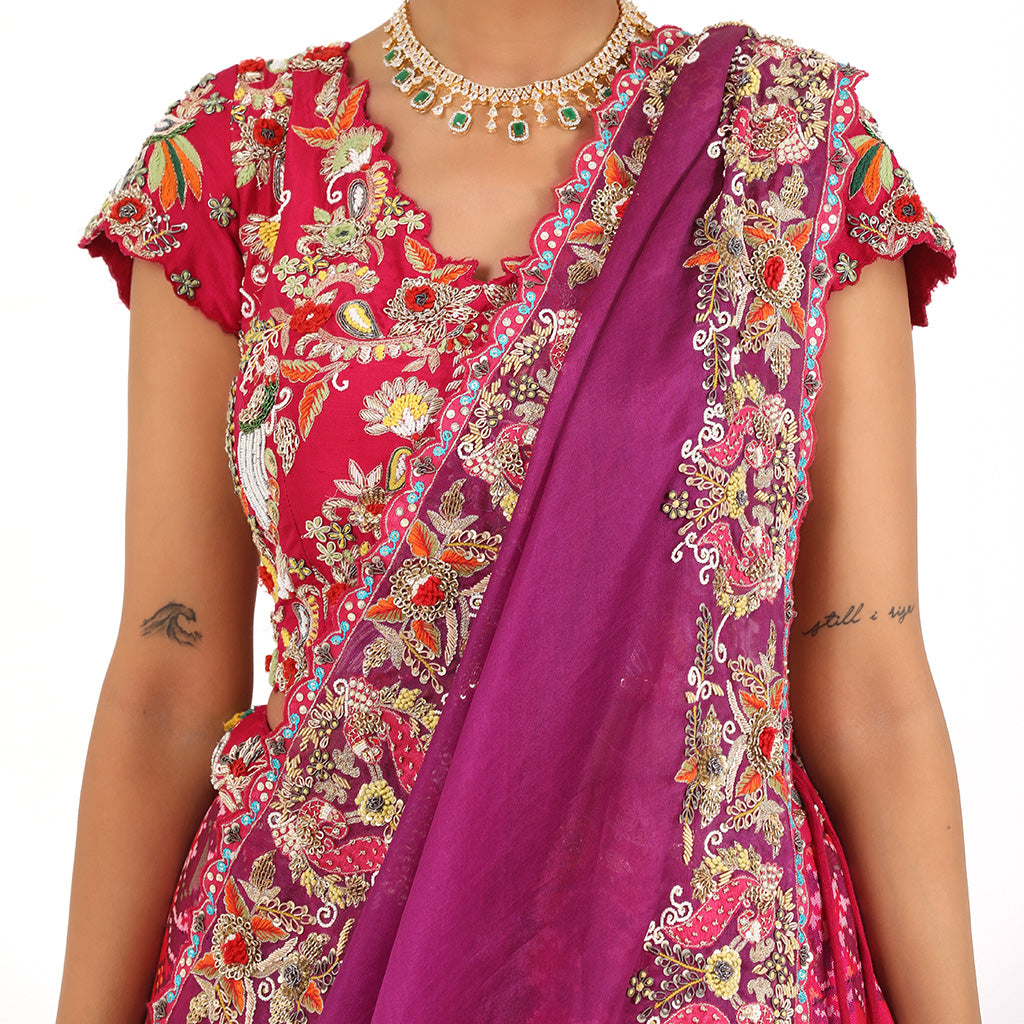 A woman wearing Elephant Motif Patola Lehenga.