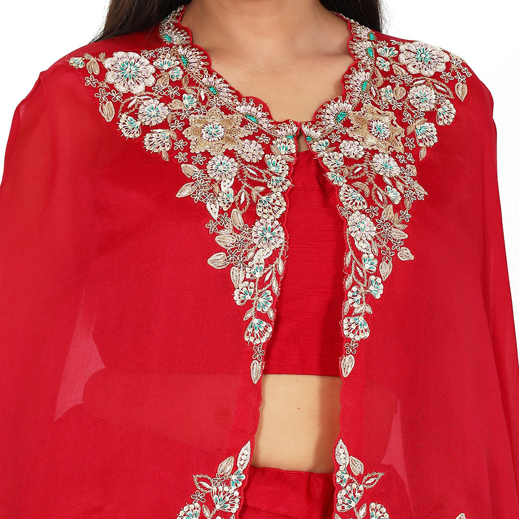 A woman wearing Crimson Red Organza Poncho with Skirt.