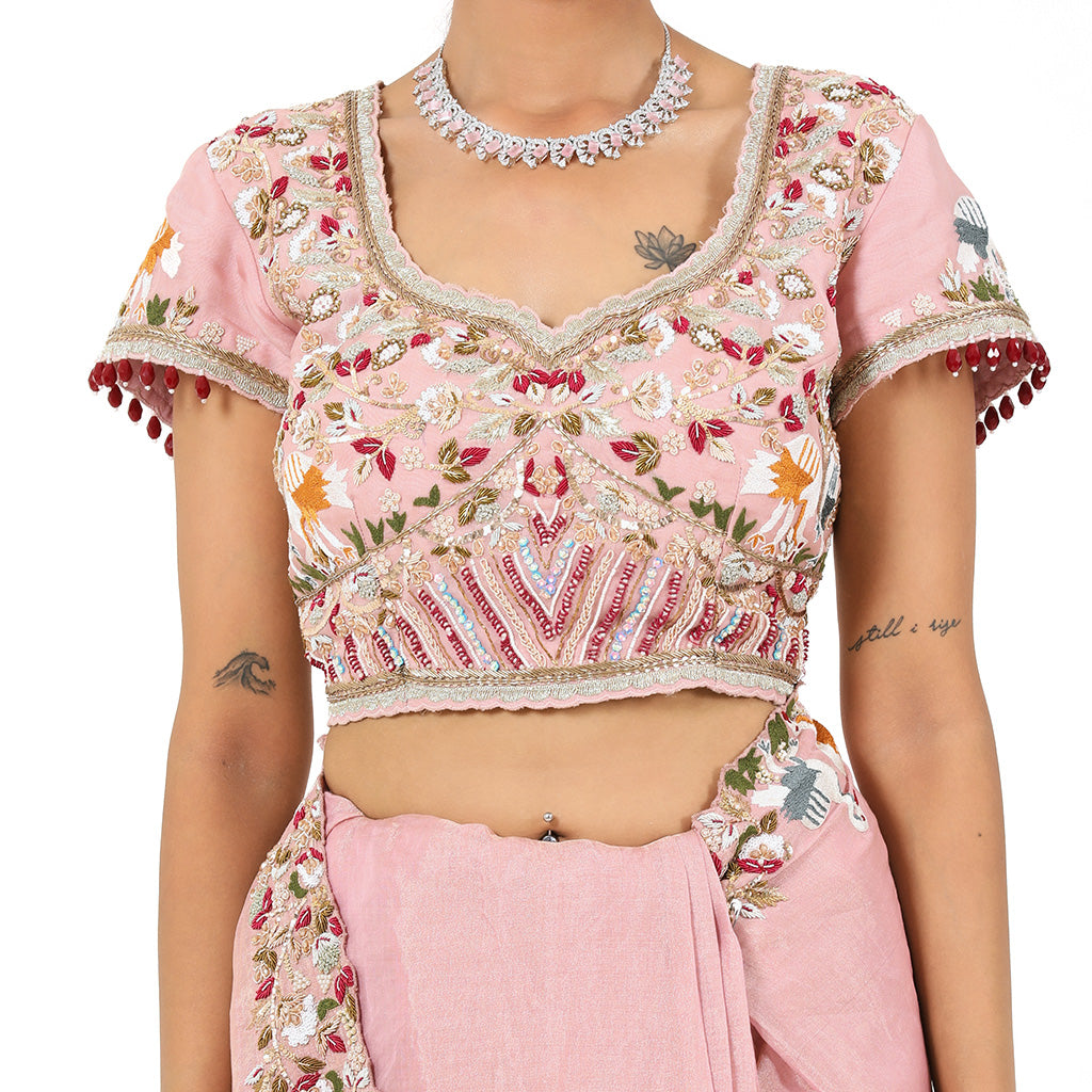 A woman wearing Pink Swan Saree.