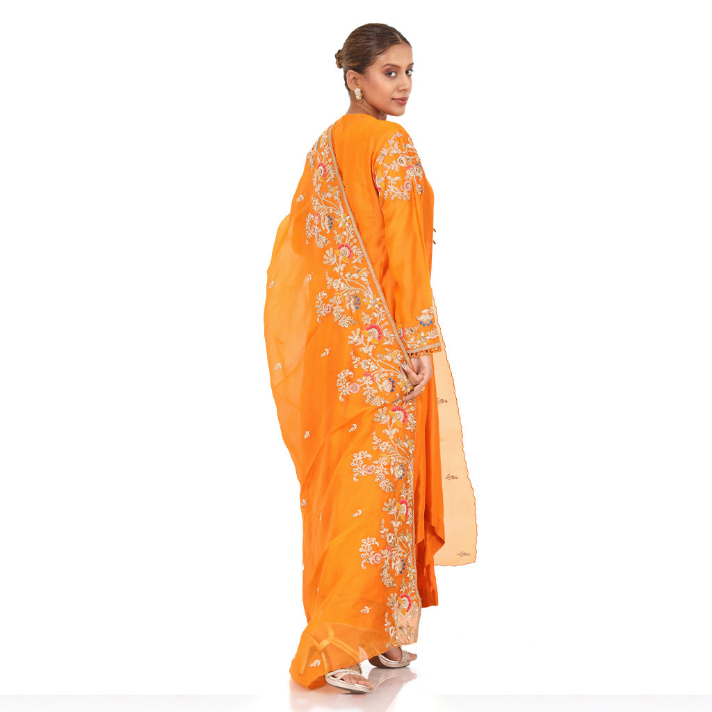 A woman wearing Designer Orange Dori Angrakha Dress.