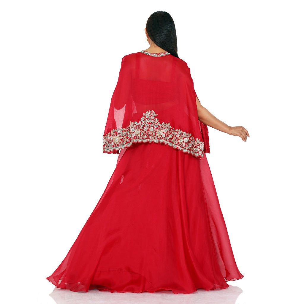 A woman wearing Crimson Red Organza Poncho with Skirt.