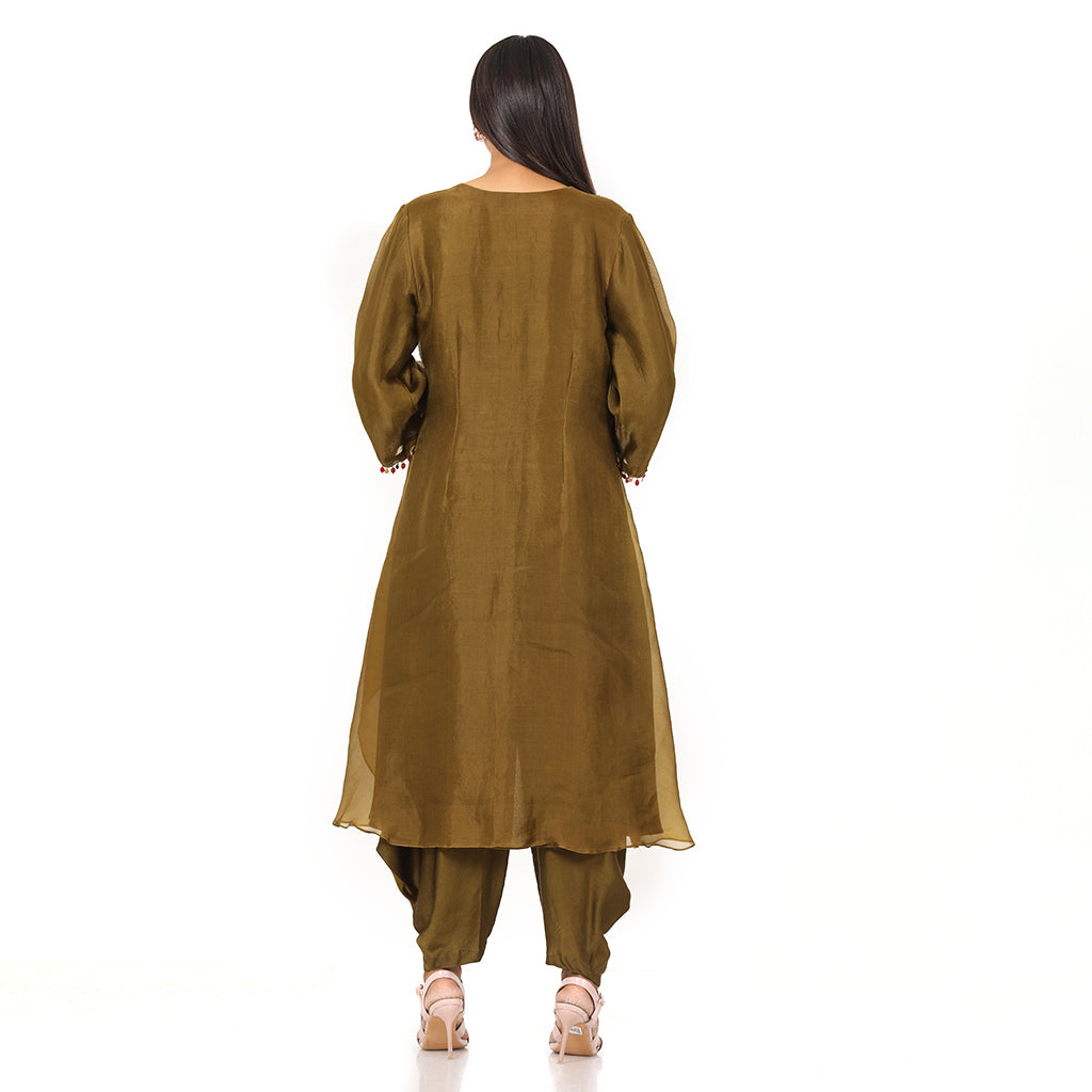 A woman standing and wearing Olive Asymmetrical Harem Set.