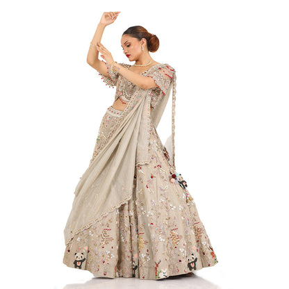 A woman standing and wearing Panda Lehenga Set.