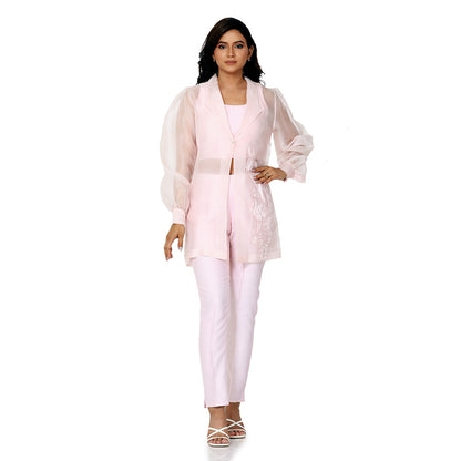 A woman standing and wearing pink colored Swan Co-Ord Set.