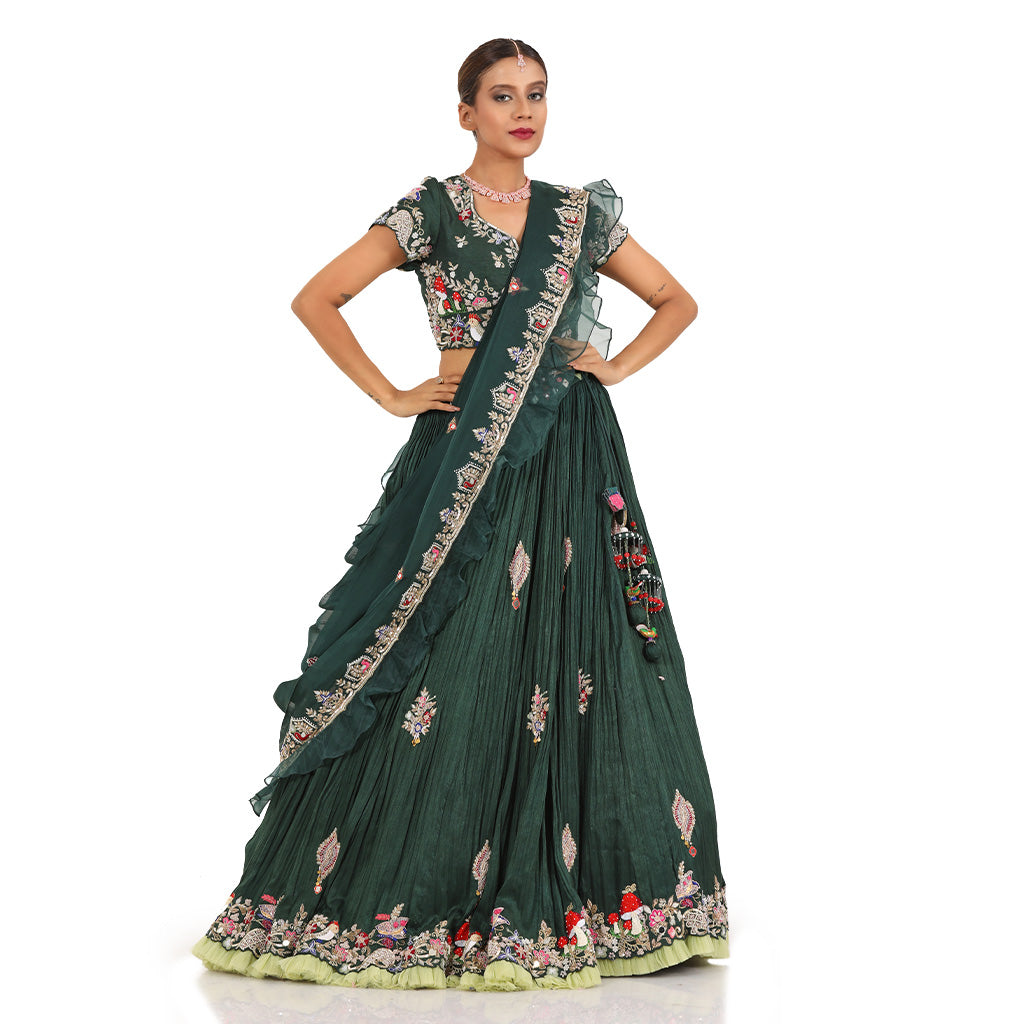 A woman wearing Bottle Green Mushroom Colored Lehenga.