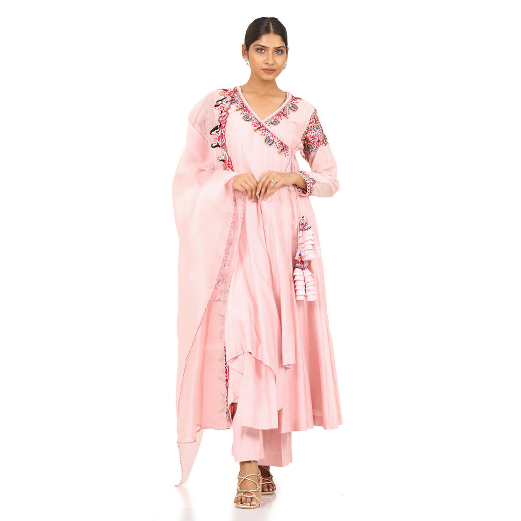 A woman wearing Designer Pink Doll Angrakha Dress.