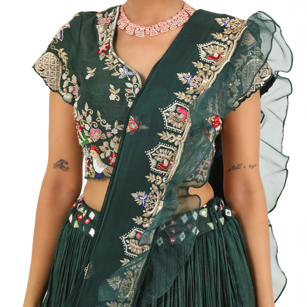 A woman wearing Bottle Green Mushroom Colored Lehenga.