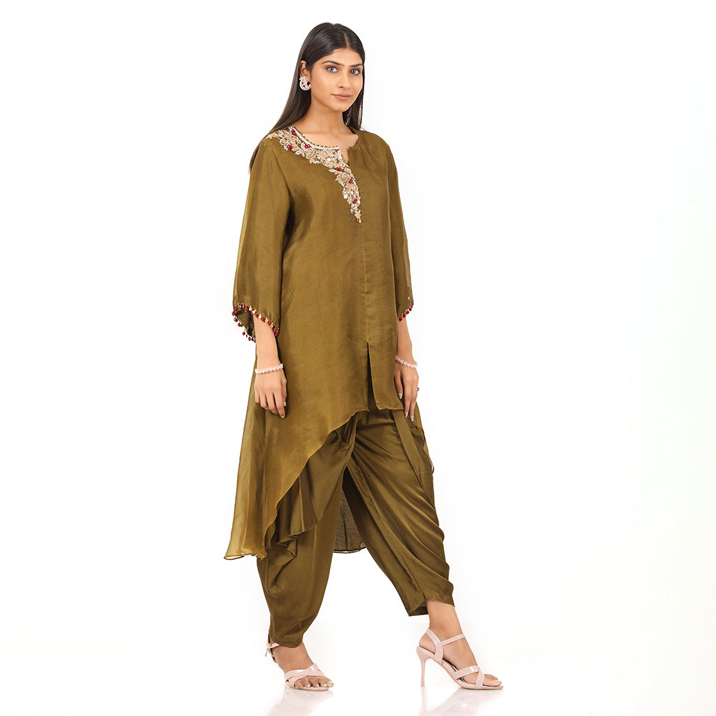 A woman standing and wearing Olive Asymmetrical Harem Set.