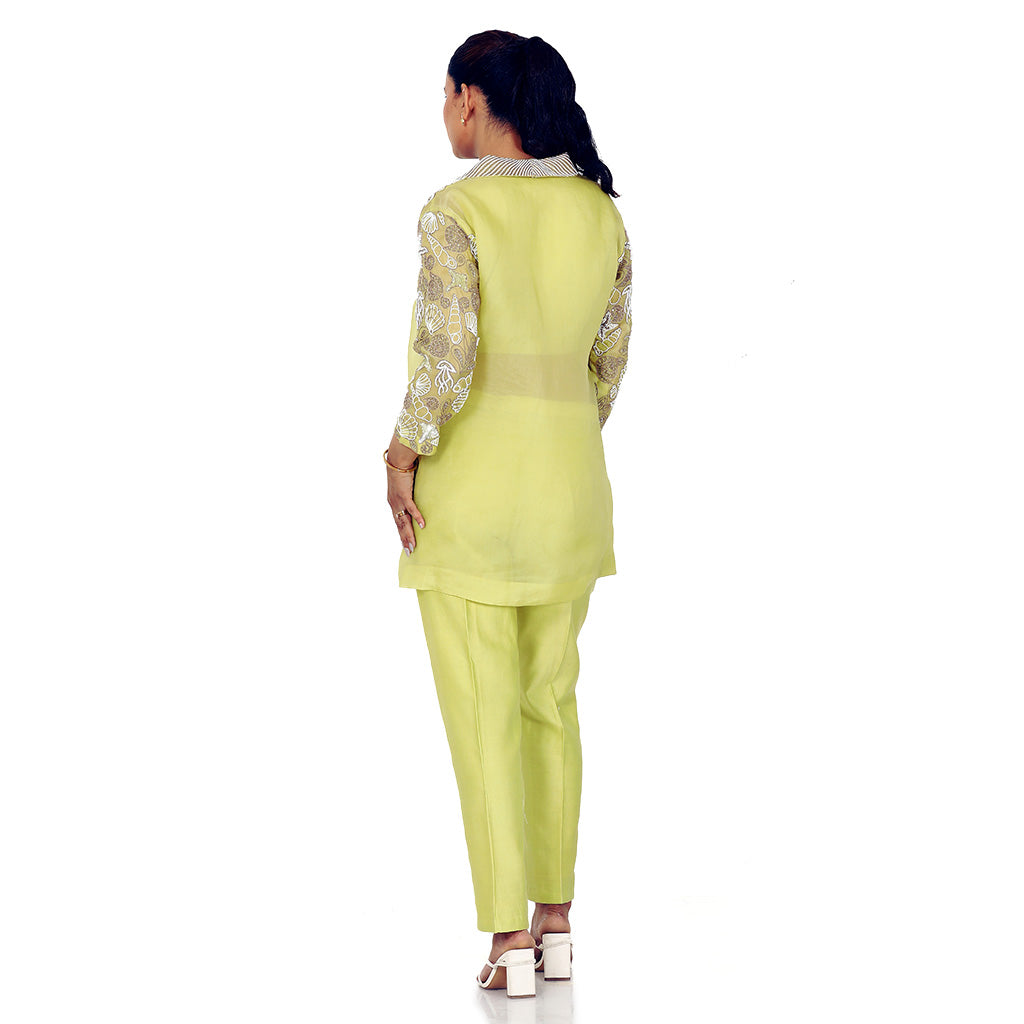 A woman standing and wearing lemon colored Starfish Co-Ord Set.