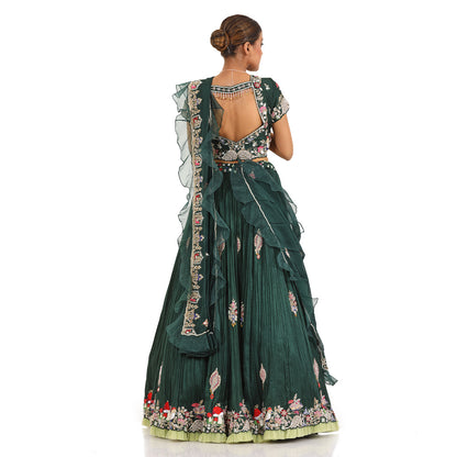 A woman wearing Bottle Green Mushroom Colored Lehenga.