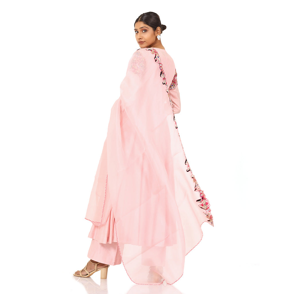 A woman wearing Designer Pink Doll Angrakha Dress.