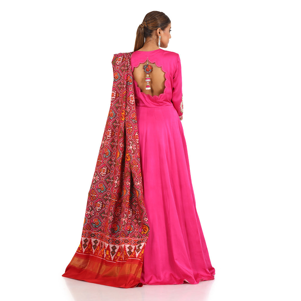 A woman wearing Fuchsia Gathered Anarkali Suit with Dupatta.