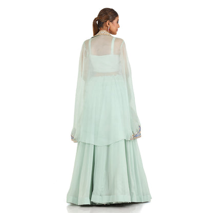 A woman wearing Sea Green Designer Mirror Cape Dress.