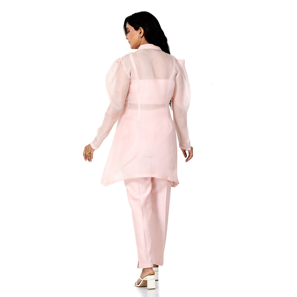 A woman standing and wearing pink colored Multi Sequin Overlap Co-Ord Set.