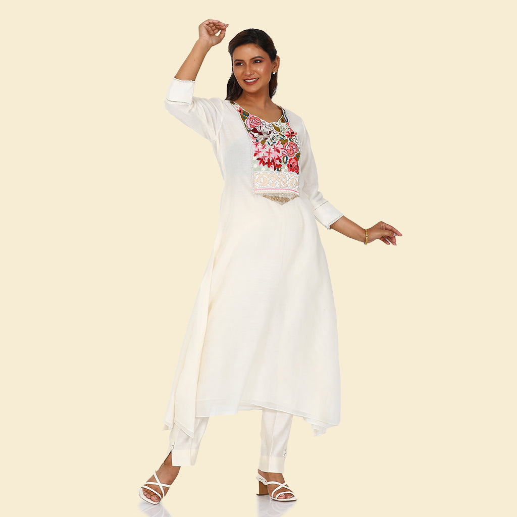 A woman standing and wearing A-Line Multifloral Kurta with Pants.