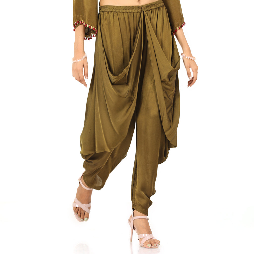 A woman standing and wearing Olive Asymmetrical Harem Set.