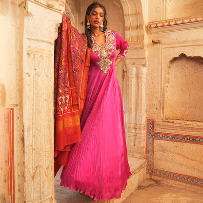 A woman wearing Fuchsia Gathered Anarkali Suit with Dupatta.