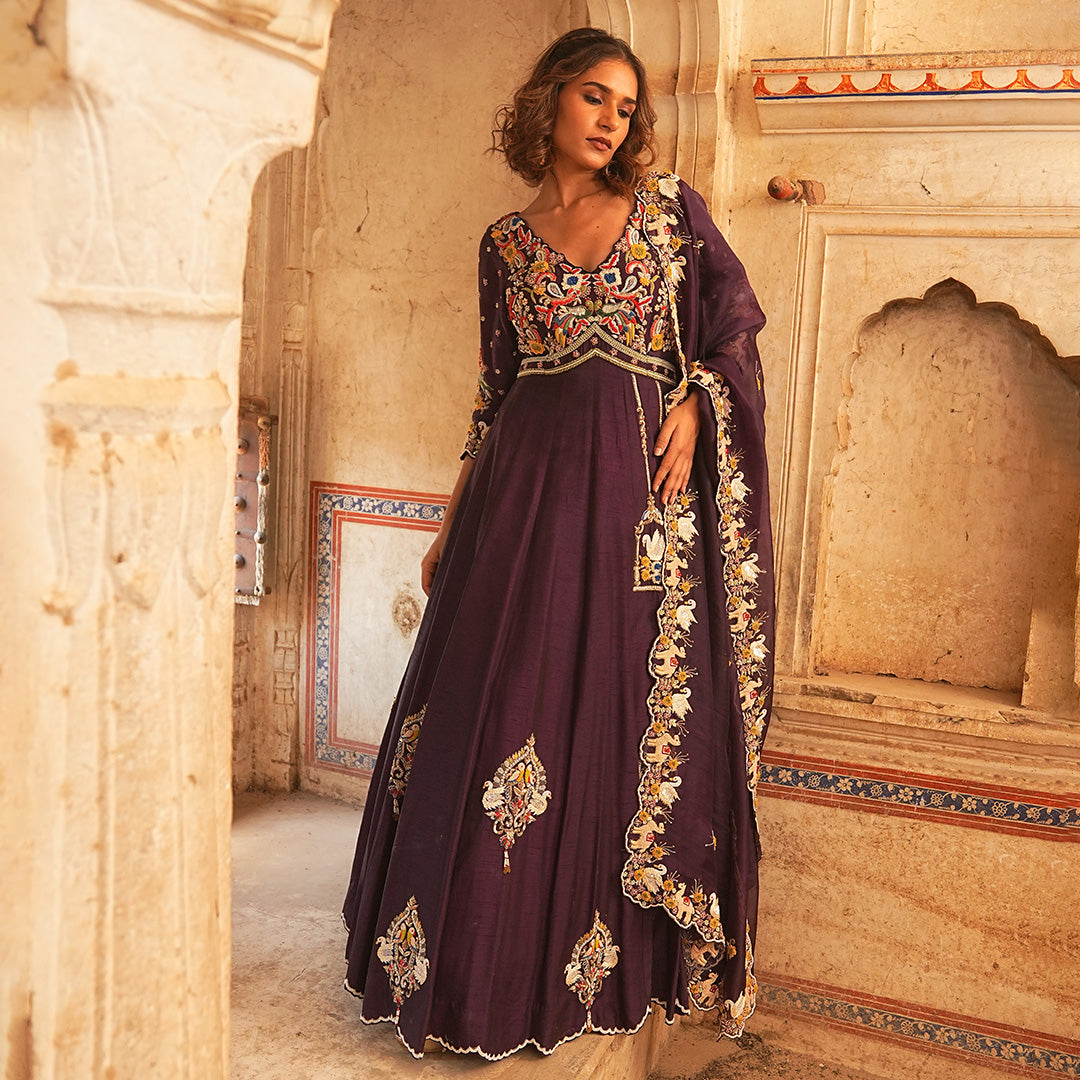 A woman wearing Wine Colored Pinjra Anarkali Dress with Dupatta.