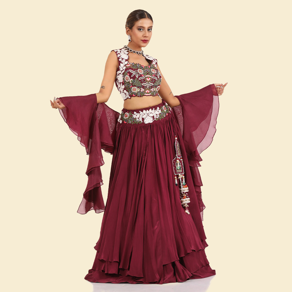 A woman wearing Wine Three Layered Drape Skirt Set.