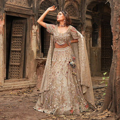 A woman standing and wearing Panda Lehenga Set.